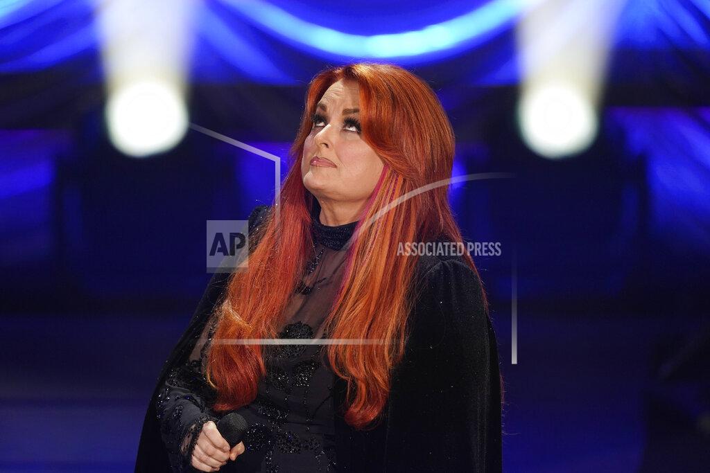 Mark Humphrey Wynonna Judd looks up after singing during a tribute to her mother, country music star Naomi Judd, Sunday, May 15, 2022, in Nashville, Tenn. Naomi Judd died April 30. She was 76. (AP Photo/Mark Humphrey)