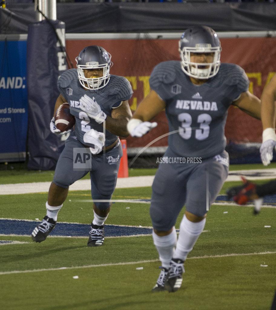 Tom R. Smedes Nevada running back Devonte Lee (2) runs out of his own end zone against San Diego State in the first half of an NCAA college football game in Reno, Nev., Saturday, Oct. 27, 2018. (AP Photo/Tom R. Smedes)