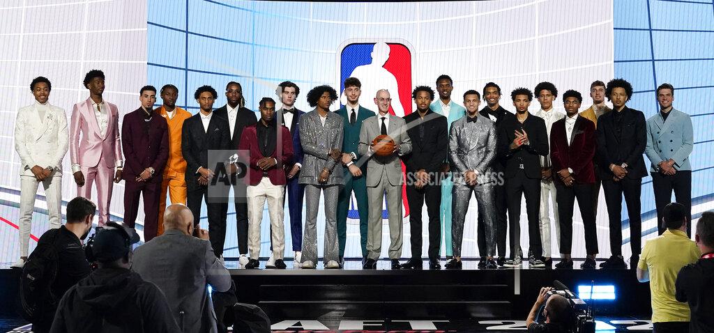 Corey Sipkin NBA Commissioner Adam Silver, center, poses for a photo with players projected to be first-round draft picks before the NBA basketball draft, Thursday, July 29, 2021, in New York. (AP Photo/Corey Sipkin)