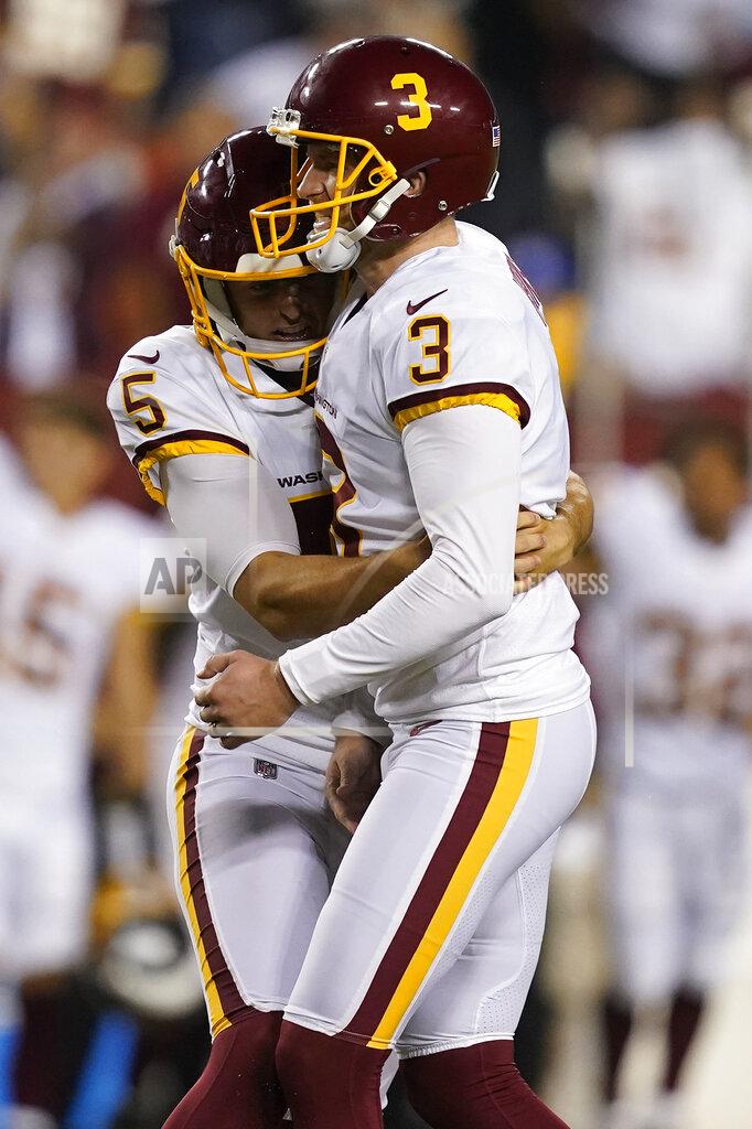 Alex Brandon Washington Football Team kicker Dustin Hopkins (3) and teammate punter Tress Way (5) celebrate Hopkins' winning field goal against the New York Giants at the end of an NFL football game, Thursday, Sept. 16, 2021, in Landover, Md. Washington won 30 - 29. (AP Photo/Alex Brandon)