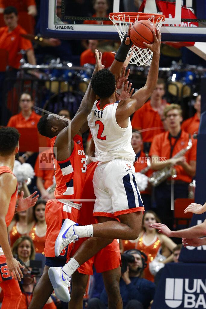 Steve Helber Virginia guard Braxton Key (2) puts up a shot in front of Syracuse forward Bourama Sidibe (34) during the first half of an NCAA college basketball game in Charlottesville, Va., Saturday, Jan. 11, 2020. (AP Photo/Steve Helber)