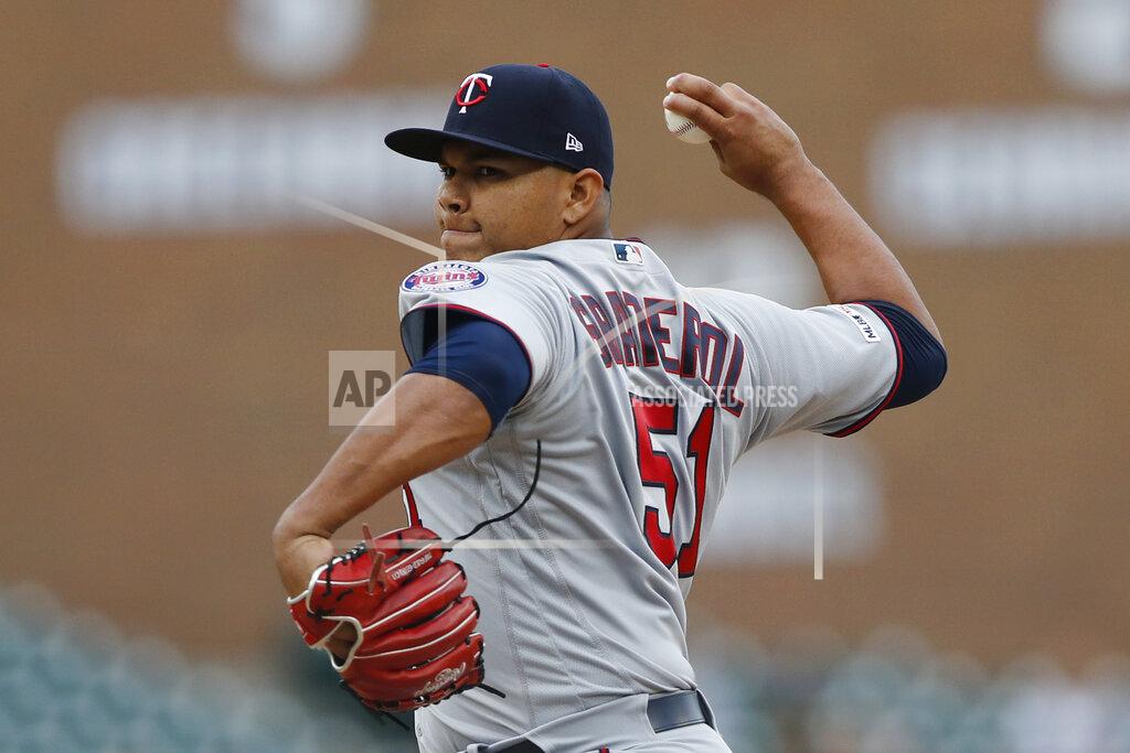 FILE - In this Sunday, Sept. 1, 2019 file photo, Minnesota Twins relief pitcher Brusdar Graterol throws his first MLB pitch during the ninth inning of a baseball game against the Detroit Tigers in Detroit. With less than a week before pitchers and catchers were scheduled to report to spring training, the Red Sox sent Mookie Betts and David Price to the Los Angeles Dodgers in a deal that brought outfielder Alex Verdugo and Twins pitching prospect Brusdar Graterol to Boston. (AP Photo/Carlos Osorio, File)