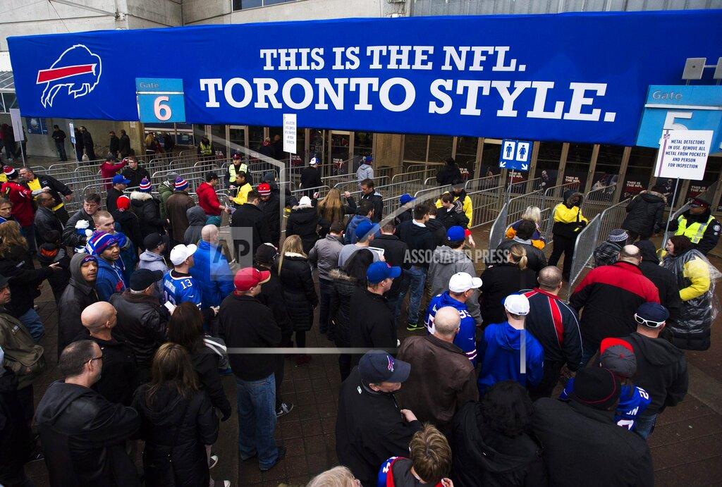 Mark Blinch FILE - In this Dec. 1, 2013, file photo, fans enter the Rogers Centre before the Buffalo Bills played the Atlanta Falcons in an NFL football game in Toronto. The NFL has played six games in Toronto and three in Mexico City. (Mark Blinch/The Canadian Press via AP)