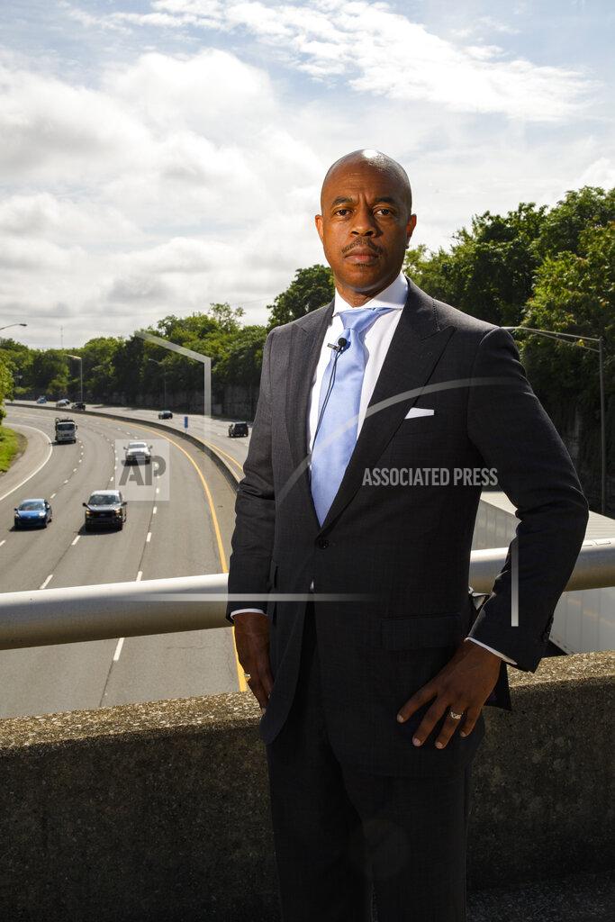 John Amis Tennessee State Rep. Harold Love, Jr. stands on an overpass over I-40, Monday, July, 19, 2021, near the site of his family's former home on the north side of Nashville, Tenn. Love Jr.'s father, a Nashville city councilman, was forced to sell his family home near this spot to make way for the highway, but put up a fight in the 1960s against the rerouting of Interstate 40 because he believed it would stifle and isolate Nashville's Black community. Love Jr. is now part of a group pushing to build a cap, across the highway behind. him, that creates a community space to help reunify the city. (AP Photo/John Amis)