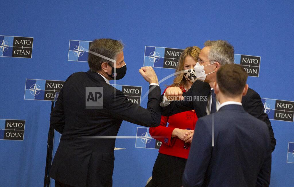 Virginia Mayo U.S. Secretary of State Antony Blinken, left, bumps elbows with NATO Secretary General Jens Stoltenberg, right, after a moderated event prior to a meeting of NATO foreign ministers at NATO headquarters in Brussels on Tuesday, March 23, 2021. (AP Photo/Virginia Mayo, Pool)