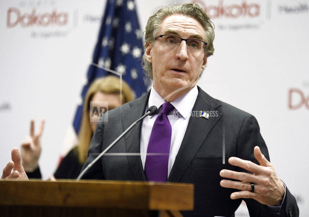 FILE - In this April 10, 2020, file photo, North Dakota Gov. Doug Burgum speaks at the state Capitol in Bismarck, N.D. A Bismarck marketing agency is rolling out a campaign meant to help stem the tide of rising COVID-19 cases in central North Dakota, and it comes at a time when the state leads the nation in cases per capita. Agency MABU was hired by a governor's task force in Burleigh and Morton counties that is nearly six weeks into its effort and frustrated by the lack of progress in the state's virus hotspot. (Mike McCleary/The Bismarck Tribune via AP, File)