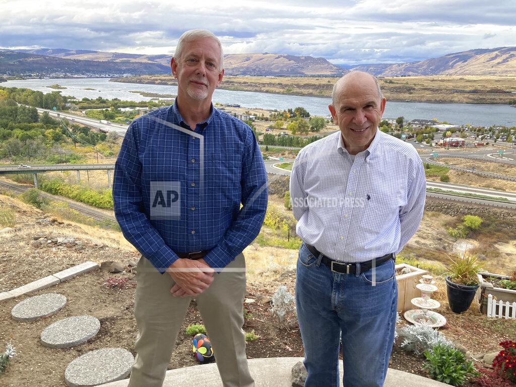 Andrew Selsky In this Tuesday, Oct. 5, 2021, photo, The Dalles city Public Works Department Director Dave Anderson, left, and Mayor Richard Mays pose for photos in The Dalles, Oregon. Mays helped negotiate a proposal by Google to build new data centers in the town. The data centers require a lot of water to cool their servers, and would use groundwater and surface water, but not any water from the Columbia River. (AP Photo/Andrew Selsky)
