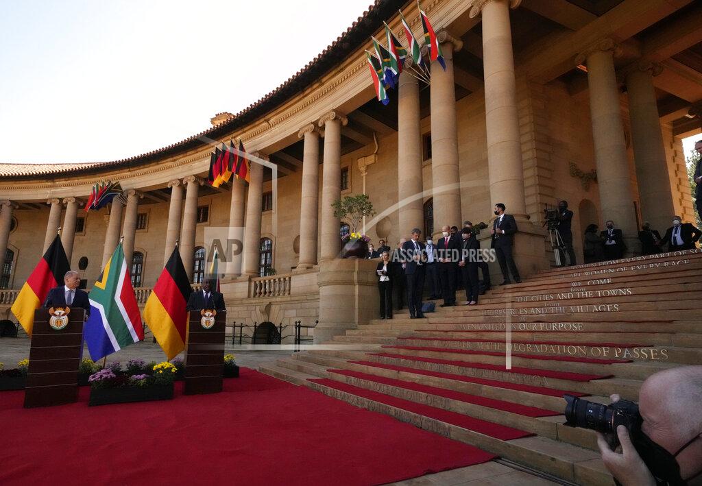 Themba Hadebe German Chancellor Olaf Scholz, left, speaks during a joint press conference with South Africa President Cyril Ramaphosa at the Union Building in Pretoria, South Africa, Tuesday, May 24, 2022. (AP Photo/Themba Hadebe)