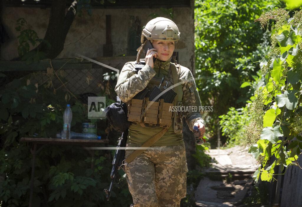Efrem Lukatsky Ukrainian platoon commander Mariia talks on the phone in a position in the Donetsk region, Ukraine, Saturday, July 2, 2022. Ukrainian soldiers returning from the frontlines in eastern Ukraine’s Donbas region describe life during what has turned into a grueling war of attrition as apocalyptic. Mariia, 41, said that front-line conditions may vary depending on where a unit is positioned and how well supplied they are. (AP Photo/Efrem Lukatsky)
