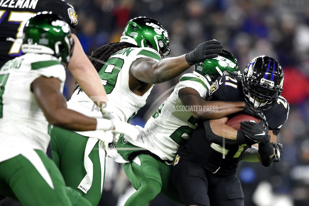 Gail Burton Baltimore Ravens running back Mark Ingram, right, is wrapped up by New York Jets free safety Marcus Maye, second from right, during the first half of an NFL football game, Thursday, Dec. 12, 2019, in Baltimore. (AP Photo/Gail Burton)