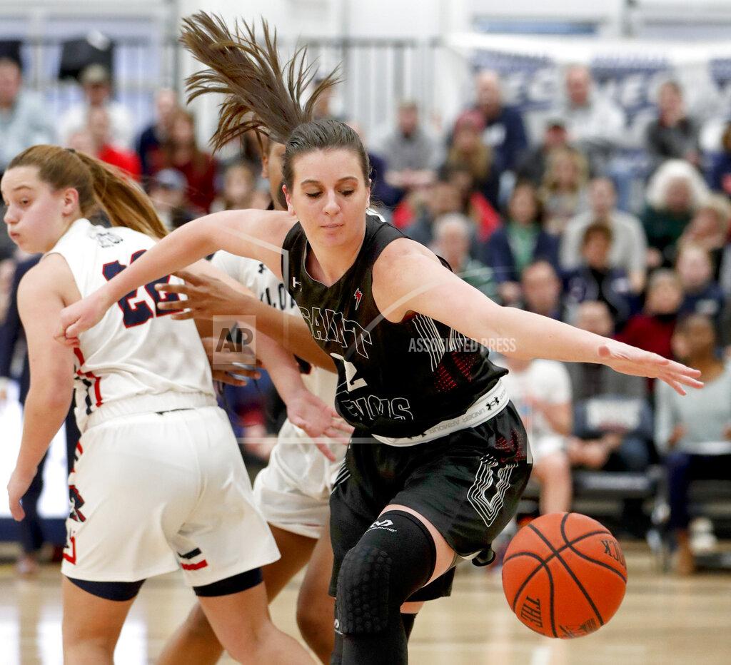 Keith Srakocic St. Francis (Pa)'s Courtney Zezza, right, chases the ball in front of Robert Morris' Esther Castedo (22) during the first half of an NCAA college basketball game for the championship of the Northeast Conference women's tournament, Sunday, March 17, 2019, in Moon, Pa. (AP Photo/Keith Srakocic)