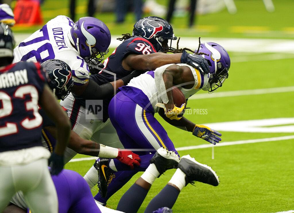 David J. Phillip Minnesota Vikings running back Dalvin Cook (33) breaks away from Houston Texans defensive end P.J. Hall (96) to score a touchdown during the first half of an NFL football game Sunday, Oct. 4, 2020, in Houston. (AP Photo/David J. Phillip)