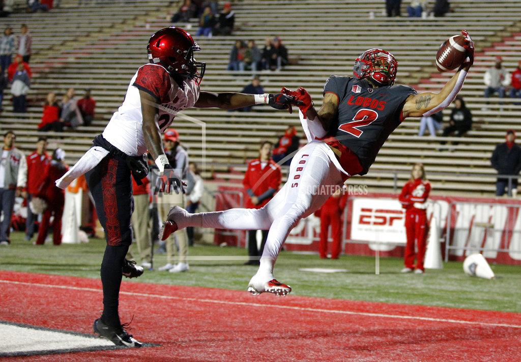 Andres Leighton New Mexico wide receiver Delane Hart-Johnson (2) pulls in a touchdown catch as San Diego State cornerback Darren Hall (23) defends during the second half of an NCAA college football game in Albuquerque, N.M., Saturday, Nov. 3, 2018. San Diego State won 31-23. (AP Photo/Andres Leighton)