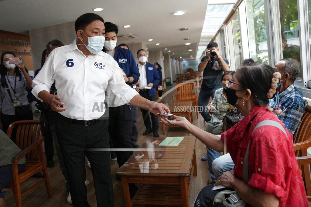 Sakchai Lalit Bangkok governor independent candidate Asawin Kwanmuang, front left, introduces himself during an election campaign in Bangkok, Thailand, Tuesday, May 17, 2022. Residents of the Thai capital Bangkok will cast their ballots for the city’s leader Sunday in a vote seen as a barometer of the public mood ahead of an approaching general election. (AP Photo/Sakchai Lalit)