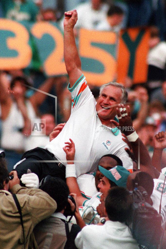 Amy Sancetta FILE - In this Nov. 14, 1993, file photo, Miami Dolphins coach Don Shula is carried on his team's shoulders after his 325th victory, at Philadelphia's Veterans Stadium. Shula, who won the most games of any NFL coach and led the Miami Dolphins to the only perfect season in league history, died Monday, May 4, 2020, at his home in Indian Creek, Fla., the team said. He was 90. (AP Photo/Amy Sancetta, File)