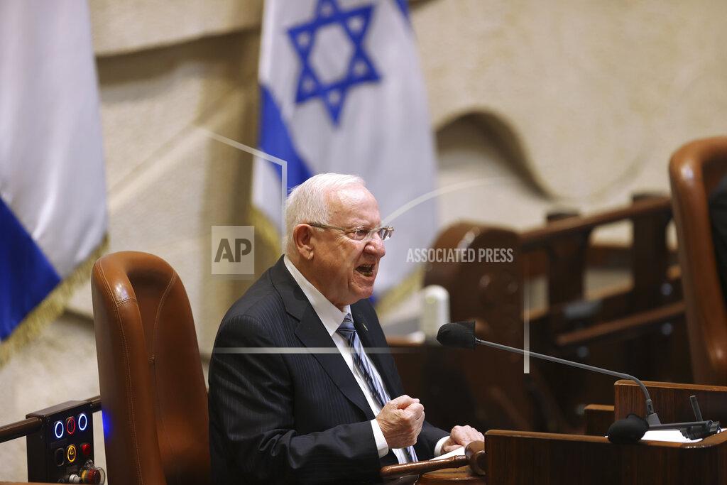 Alex Kolomoisky Israeli President Reuvan Rivlin speaks during the swearing-in ceremony for Israel's 24th government, at the Knesset, or parliament, in Jerusalem, Tuesday, April 6, 2021. The ceremony took place shortly after the country's president asked Prime Minister Benjamin Netanyahu to form a new majority coalition, a difficult task given the deep divisions in the fragmented parliament. (Alex Kolomoisky/Pool via AP)