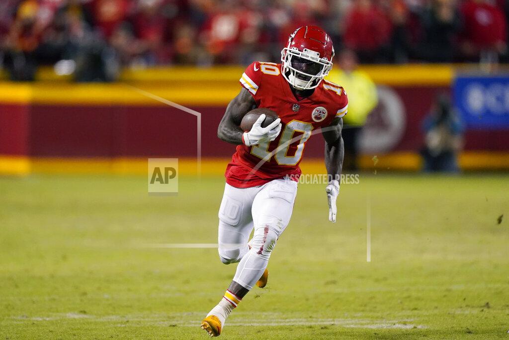 Charlie Riedel Kansas City Chiefs wide receiver Tyreek Hill (10) scores on a 64-yard touchdown reception during the second half of an NFL divisional round playoff football game against the Buffalo Bills, Sunday, Jan. 23, 2022, in Kansas City, Mo. (AP Photo/Charlie Riedel)