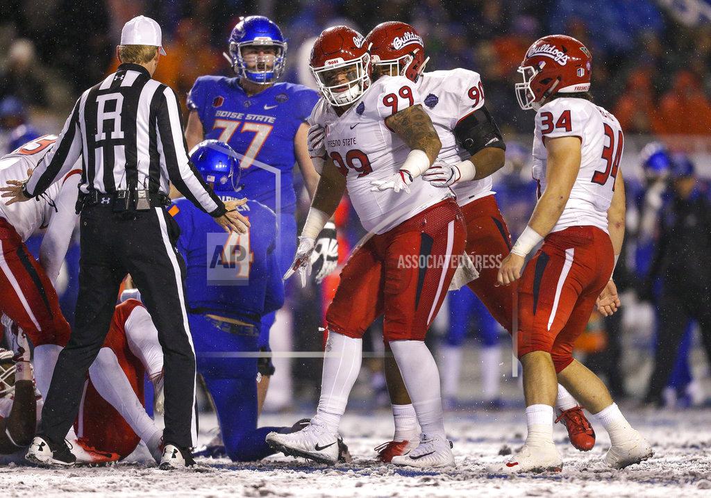Steve Conner Fresno State defensive lineman Ricky McCoy (99) celebrates with teammates after sacking Boise State quarterback Brett Rypien (4) during the second half of an NCAA college football game for the Mountain West championship, Saturday, Dec. 1, 2018, in Boise, Idaho. Fresno State won 19-16. (AP Photo/Steve Conner)