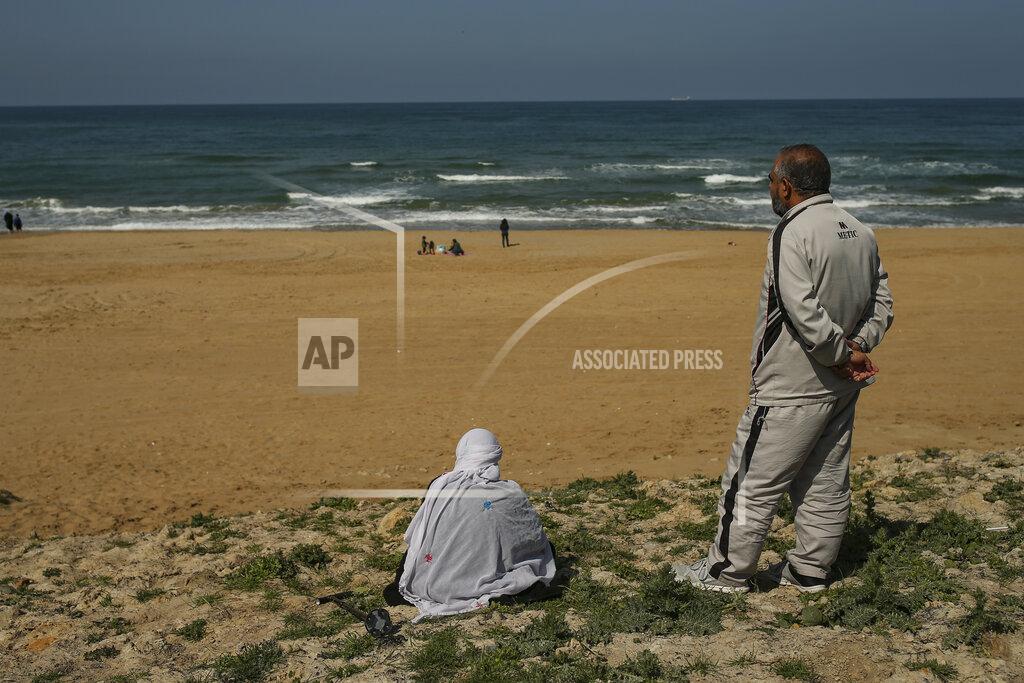 Emrah Gurel People visit the beach in Kilyos, northern Istanbul, Thursday, April 29, 2021, a few hours before the start of the latest lockdown to help protect from the spread of the coronavirus. People stocked up on groceries, shoppers filled markets and many left cities for their hometowns or the southern coast as Turkey's strictest COVID-19 lockdown yet came into effect late Thursday. President Recep Tayyip Erdogan imposed a "full lockdown" until May 17 amid soaring COVID-19 infections and deaths. Turkey now ranks among the world's worst-hit countries and it's the first time that it is imposing a nearly three-week lockdown for the whole of the country. (AP Photo/Emrah Gurel)
