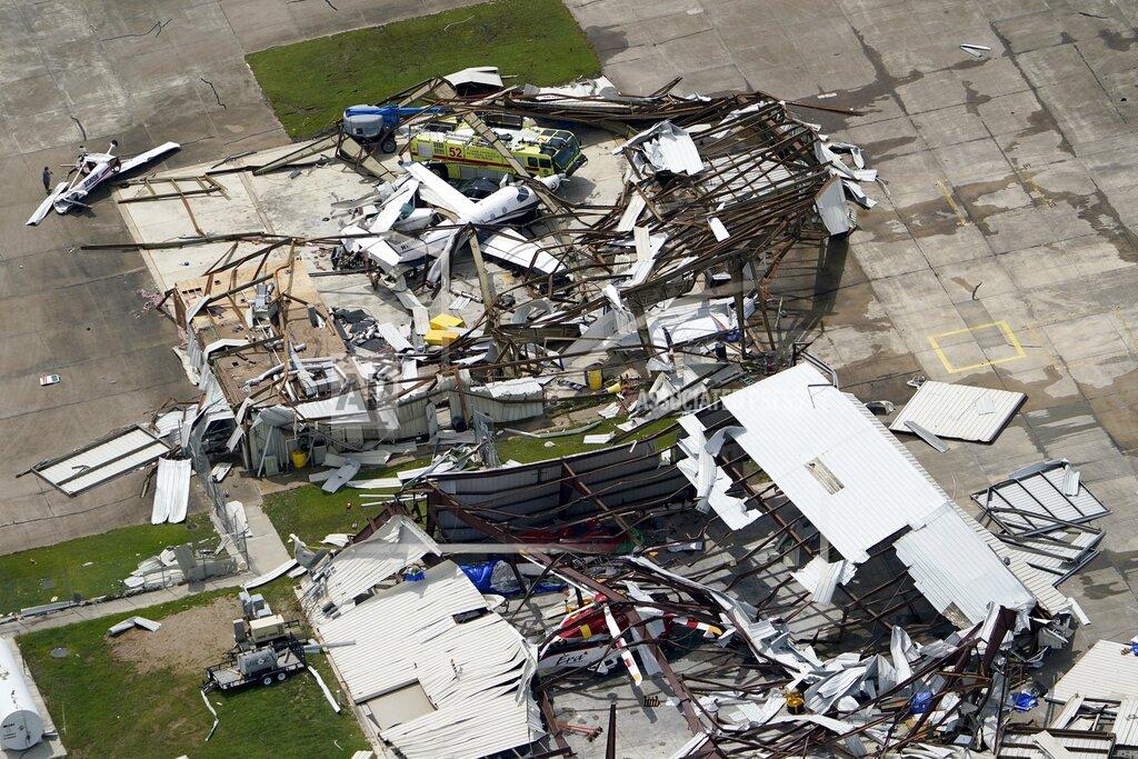 David J. Phillip A airplane hanger is destroyed Thursday, Aug. 27, 2020, after Hurricane Laura went through the area near Lake Charles, La. (AP Photo/David J. Phillip)