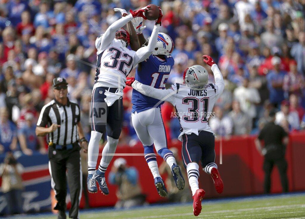 Ron Schwane New England Patriots safety Devin McCourty (32) intercepts a pass intended for Buffalo Bills wide receiver John Brown (15) in the first half of an NFL football game, Sunday, Sept. 29, 2019, in Orchard Park, N.Y. (AP Photo/Ron Schwane)