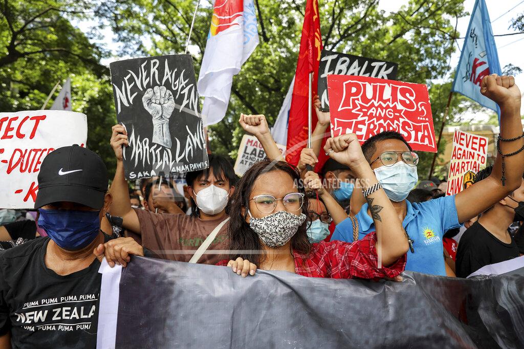 Basilio Sepe Activists protest against presidential frontrunner Ferdinand "Bongbong" Marcos and running mate Sara Duterte, daughter of the current president, during a rally at the Commission on Human Rights in Quezon City, Metro Manila, Philippines on Wednesday. May 25, 2022. Marcos Jr. continues to lead in the official canvassing of votes. (AP Photo/Basilio Sepe)