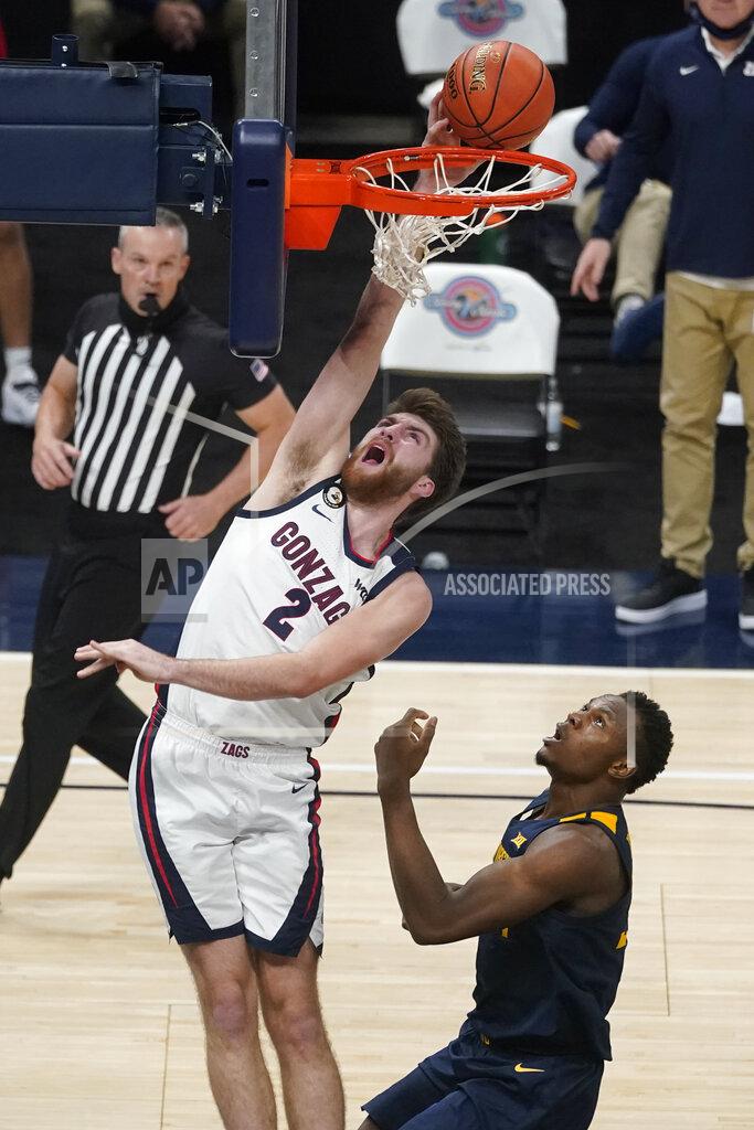 Darron Cummings Gonzaga's Drew Timme (2) shoots over West Virginia's Oscar Tshiebwe (34) during the second half of an NCAA college basketball game, Wednesday, Dec. 2, 2020, in Indianapolis. (AP Photo/Darron Cummings)