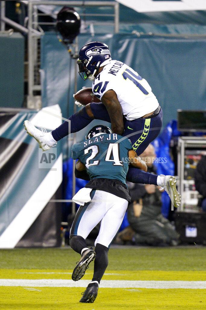 Chris Szagola Seattle Seahawks' DK Metcalf (14) tries to hurdle Philadelphia Eagles' Darius Slay (24) during the first half of an NFL football game, Monday, Nov. 30, 2020, in Philadelphia. (AP Photo/Chris Szagola)