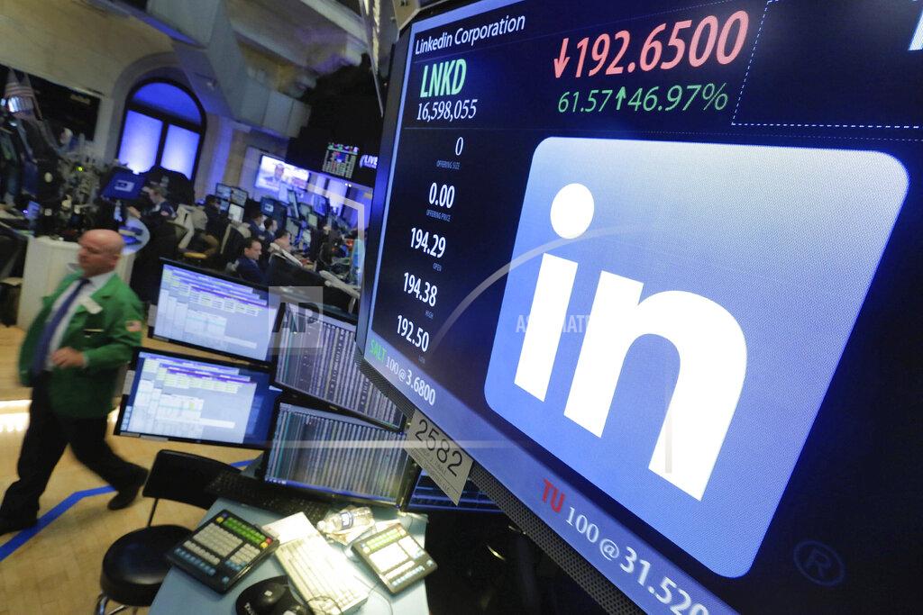 Richard Drew FILE - In this Monday, June 13, 2016, file photo, the LinkedIn logo appears on a screen at the post where it trades on the floor of the New York Stock Exchange. LinkedIn is laying off nearly 1,000 employees, or approximately 6% of its global workforce, Tuesday, July 21, 2020, as a slowdown in hiring amid the coronavirus pandemic pressures its business.
In a note to employees, CEO Ryan Roslansky said that the positions that will be eliminated are in its global sales and talent acquisition organizations. (AP Photo/Richard Drew, File)