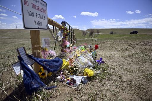 Colorado men accused of taking 'memento' photo after rock-throwing death appear in court - Vimarsana News
