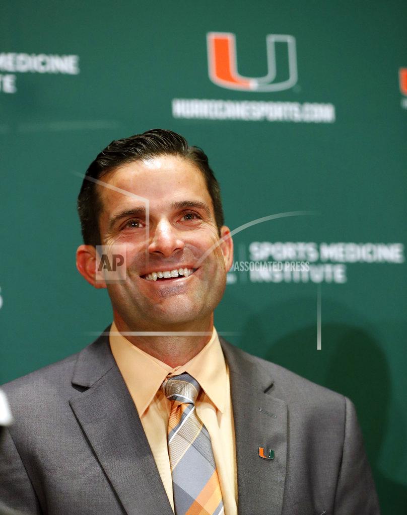 Wilfredo Lee Manny Diaz smiles as he answers questions during a news conference before being introduced as Miami's new NCAA college football head coach, Wednesday, Jan. 2, 2019, in Coral Gables, Fla. (AP Photo/Wilfredo Lee)