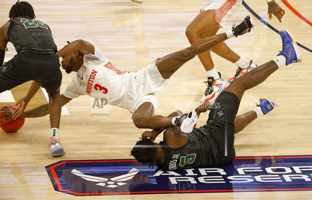 Ron Jenkins Houston guard DeJon Jarreau (3) dives over Tulane forward Kevin Cross (5) to battle Tulane guard Jaylen Forbes (25) for the ball during the first half of an NCAA college basketball game in the quarterfinal round of the American Athletic Conference men's tournament Friday, March 12, 2021, in Fort Worth, Texas. (AP Photo/Ron Jenkins)