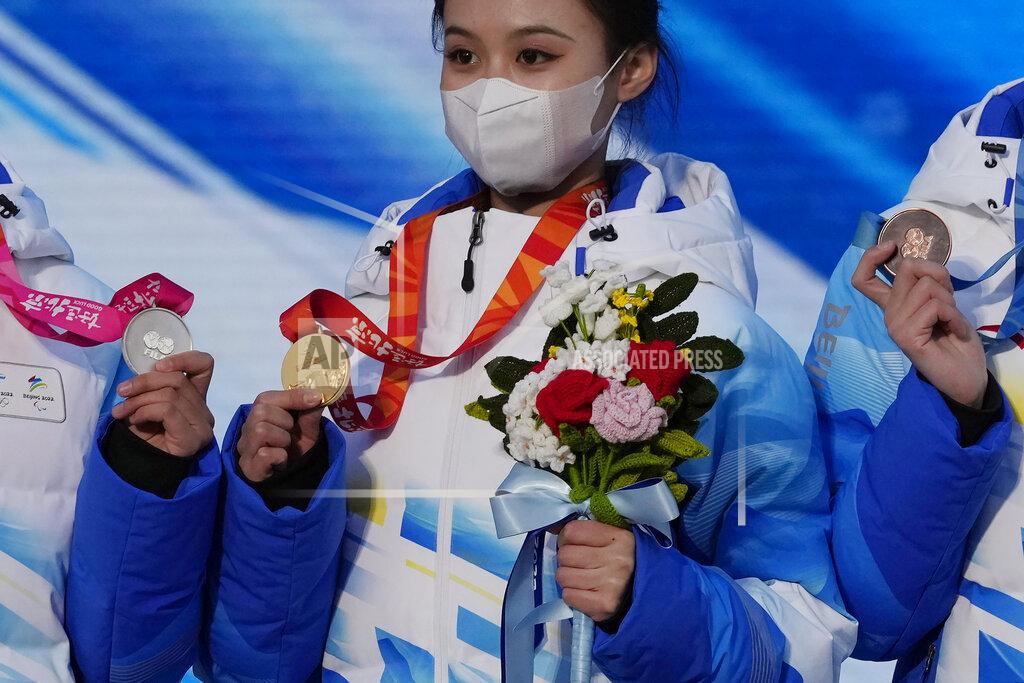 Staff members hold up medals as they rehearse a victory ceremony at the Beijing Medals Plaza of the Winter Olympics in Beijing, China on Jan. 3, 2022. The Beijing Winter Olympics open in 30 days, and Norway is expected to head the medal table for the second straight time, even topping its record haul of 39 medals in 2018 in Pyeongchang, South Korea. This is the prediction of U.S.-based Gracenote Sports, which released its outlook on Wednesday, Jan. 5, 2022 with the Olympics opening on Feb. 4. (AP Photo/Ng Han Guan)