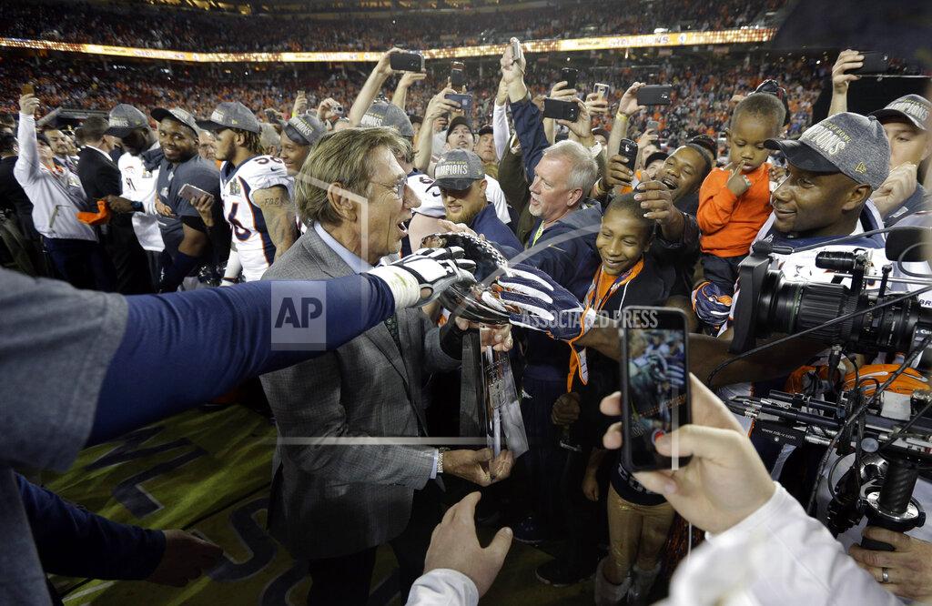 Julie Jacobson FILE - In this Feb. 7, 2016, file photo, Joe Namath, MVP of Super Bowl III, carries the Lombardi Trophy onto the field for the postgame ceremony after the NFL Super Bowl 50 football game between the Denver Broncos and the Carolina Panthers, in Santa Clara, Calif. Just over 50 years ago, halfway through the history of the NFL, the New York Jets completed one of the most unexpected championship seasons in the history of the sport when a brash quarterback named Joe Namath helped engineer a Super Bowl victory over the heavily favored Baltimore Colts. That now-famous journey by Broadway Joe and the boys through the AFL that ended in triumph in Miami took a lesser-known detour for the second week of the schedule. Yes, for one weekend, the Jets actually landed in Birmingham, Alabama, at Legion Field. (AP Photo/Julie Jacobson, File)
