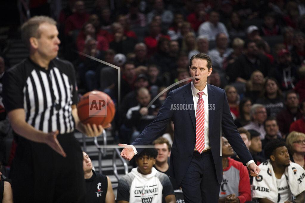 Albert Cesare Cincinnati coach John Brannen yells at a referee after the ball was ruled last touched by Cincinnati, during the second half of the team's NCAA college basketball game against Central Florida on Wednesday, Feb. 19, 2020, in Cincinnati. (Albert Cesare/The Cincinnati Enquirer via AP)