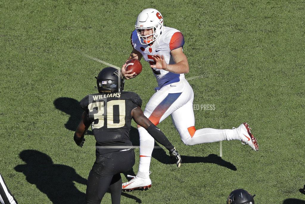 Chuck Burton Syracuse's Eric Dungey (2) runs as Wake Forest's Ja'Cquez Williams (30) defends in the second half of an NCAA college football game in Charlotte, N.C., Saturday, Nov. 3, 2018. (AP Photo/Chuck Burton)