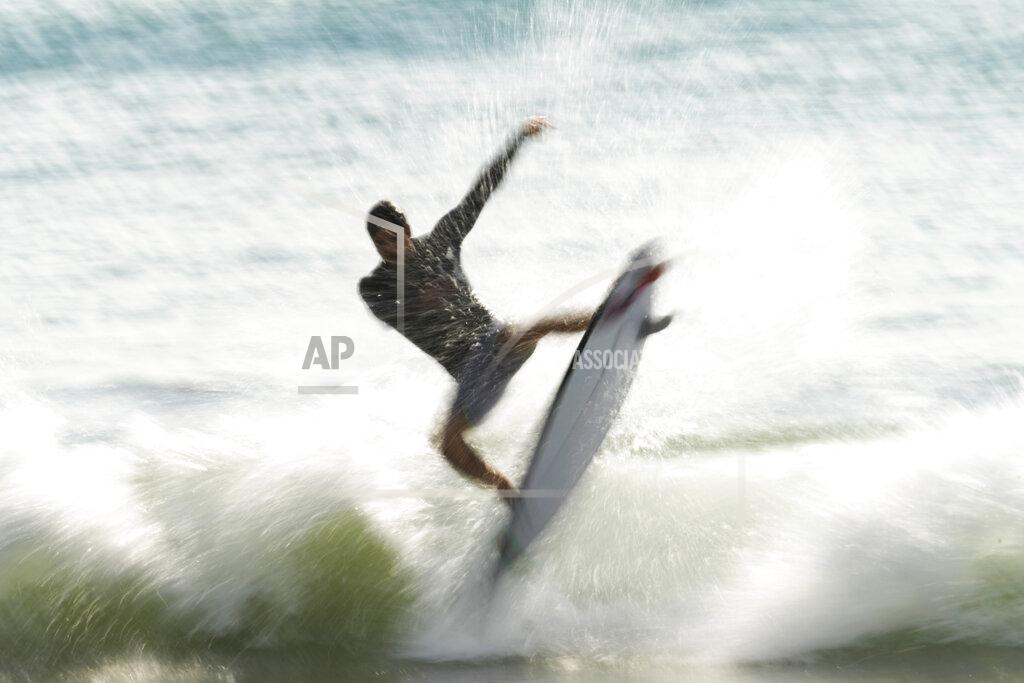 Francisco Seco Brazil's Gabriel Medina rides a wave during a training session at the 2020 Summer Olympics, Friday, July 23, 2021, at Tsurigasaki beach in Ichinomiya, Japan. (AP Photo/Francisco Seco)