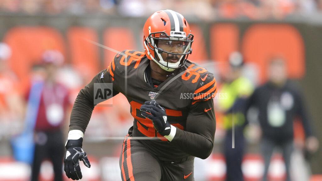 David Richard FILE- In this Sunday, Sept. 8, 2019, file photo, Cleveland Browns defensive end Myles Garrett (95) rushes the passer in the first half of an NFL football game against the Tennessee Titans in Cleveland. Garrett has six sacks this season, (AP Photo/David Richard)
