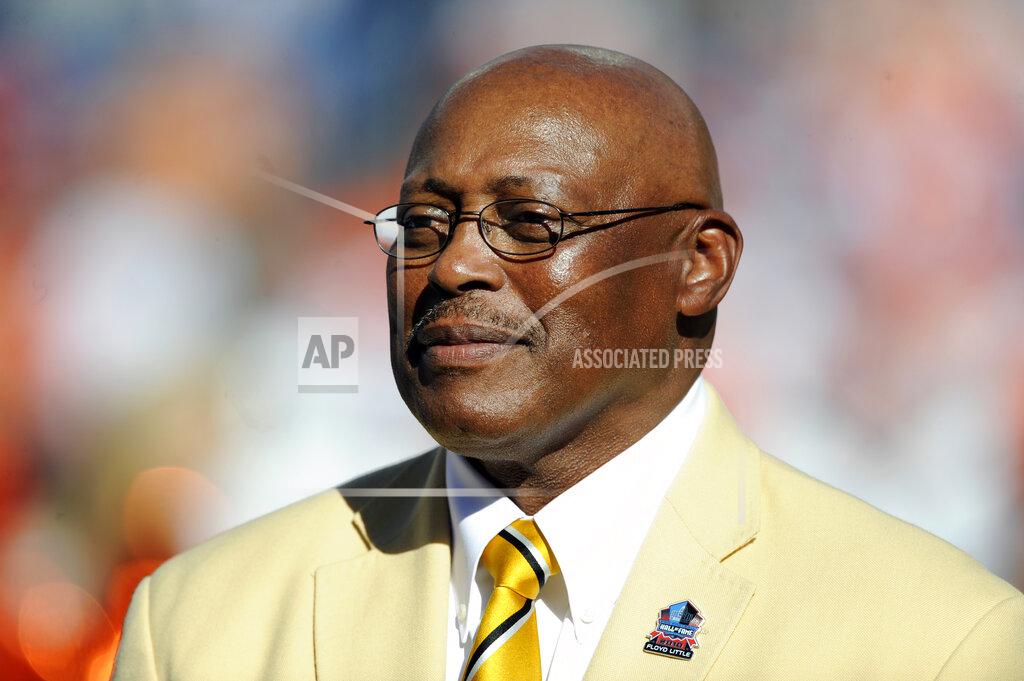 Jack Dempsey FILE - In this Sept. 26, 2010 file photo, former Denver Broncos running back Floyd Little speaks during the halftime of an NFL football game between the Indianapolis Colts and the Denver Broncos n Denver. Little, the Hall of Fame running back who starred at Syracuse and for the Denver Broncos, has died. The Pro Football Hall of Fame said he died Friday, Jan. 1, 2021. (AP Photo/ Jack Dempsey, File )