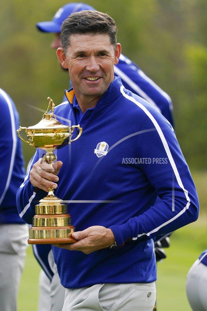 Charlie Neibergall Team Europe captain Padraig Harrington holds the trophy as they pose for a team picture during a practice day at the Ryder Cup at the Whistling Straits Golf Course Tuesday, Sept. 21, 2021, in Sheboygan, Wis. (AP Photo/Charlie Neibergall)