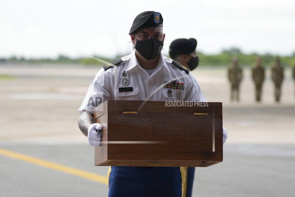 Sakchai Lalit A U.S. Army soldier carries the possible remains of a WWII U.S. airman found in northern Thailand, during a repatriation ceremony Wednesday, May 18, 2022, at the U-Tapao Air Base in Rayong province, eastern Thailand. The possible human remains were found at a crash site in a rice field in northern Thailand by the Defense POW/MIA Accounting Agency and were sent to Hawaii where they will be tested to see if they belong to a U.S. pilot who went missing in 1944. (AP Photo/Sakchai Lalit)