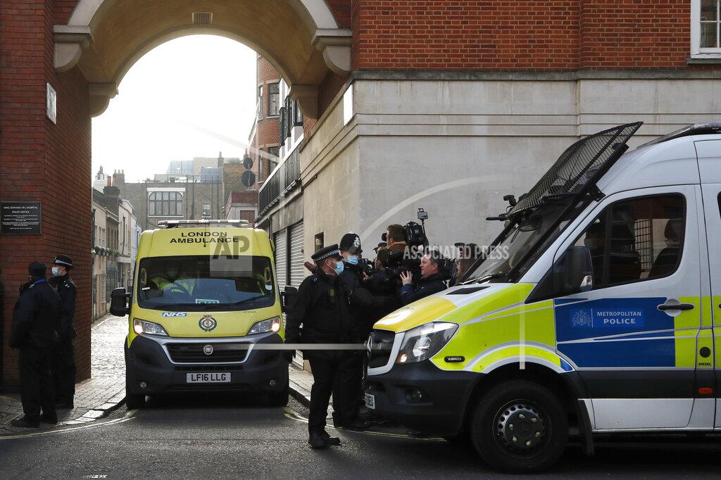 Frank Augstein Police officers stand at an entrance to the King Edward VII Hospital where Prince Philip is being treated for an infection, as an ambulance is driven out, in London, Monday, March 1, 2021. (AP Photo/Frank Augstein)