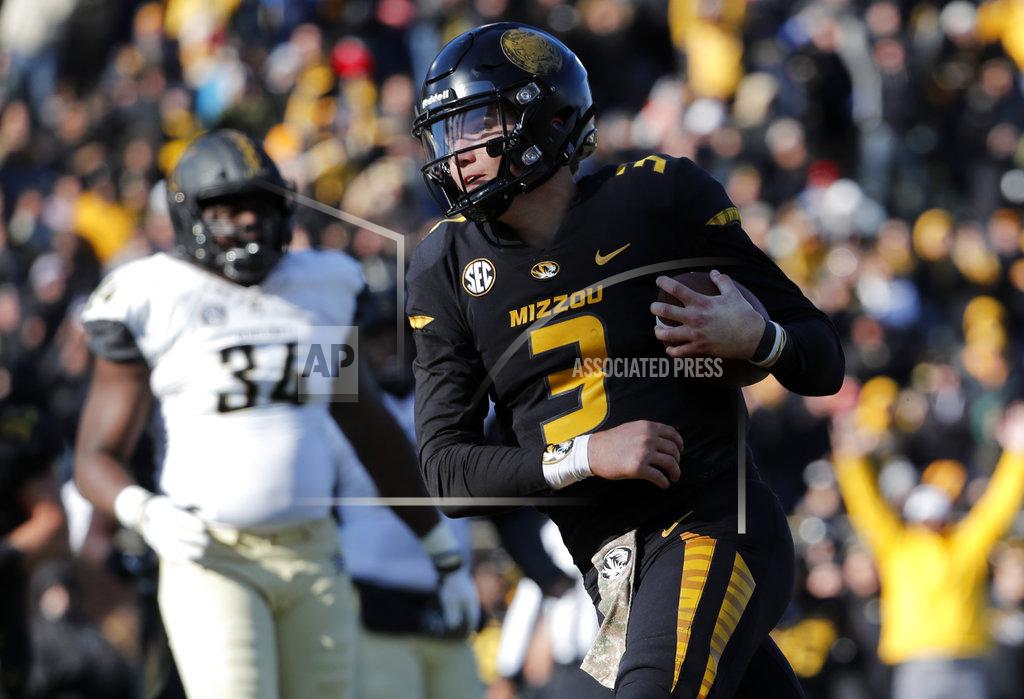 Jeff Roberson FILE - In this Nov. 10, 2018, file photo, Missouri quarterback Drew Lock scores on a 3-yard touchdown run during an NCAA college football game against Vanderbilt in Columbia, Mo. Tennessee has an opportunity Saturday to show how far it has come in the last year. The Volunteers can become bowl eligible by beating Missouri in their home finale. (AP Photo/Jeff Roberson, File)