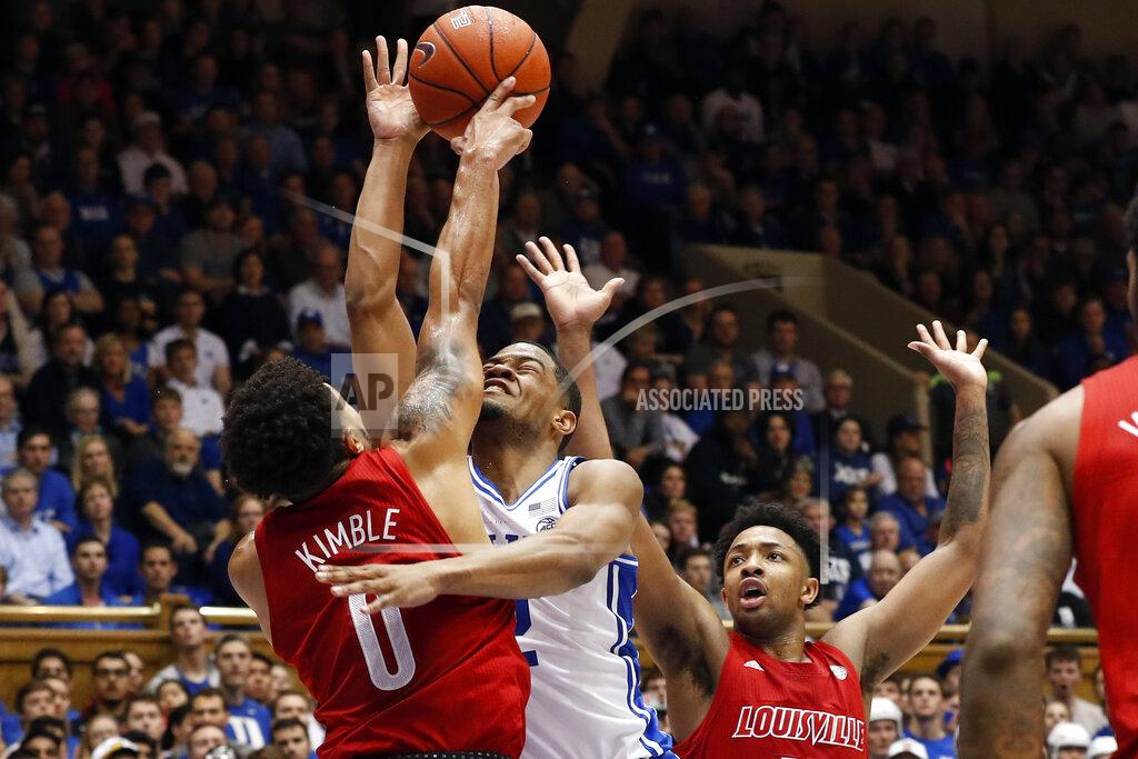 Gerry Broome Duke guard Cassius Stanley drives to the basket while Louisville guards Lamarr Kimble (0) and David Johnson, right, defend during the second half of an NCAA college basketball game in Durham, N.C., Saturday, Jan. 18, 2020. Louisville won 79-73. (AP Photo/Gerry Broome)