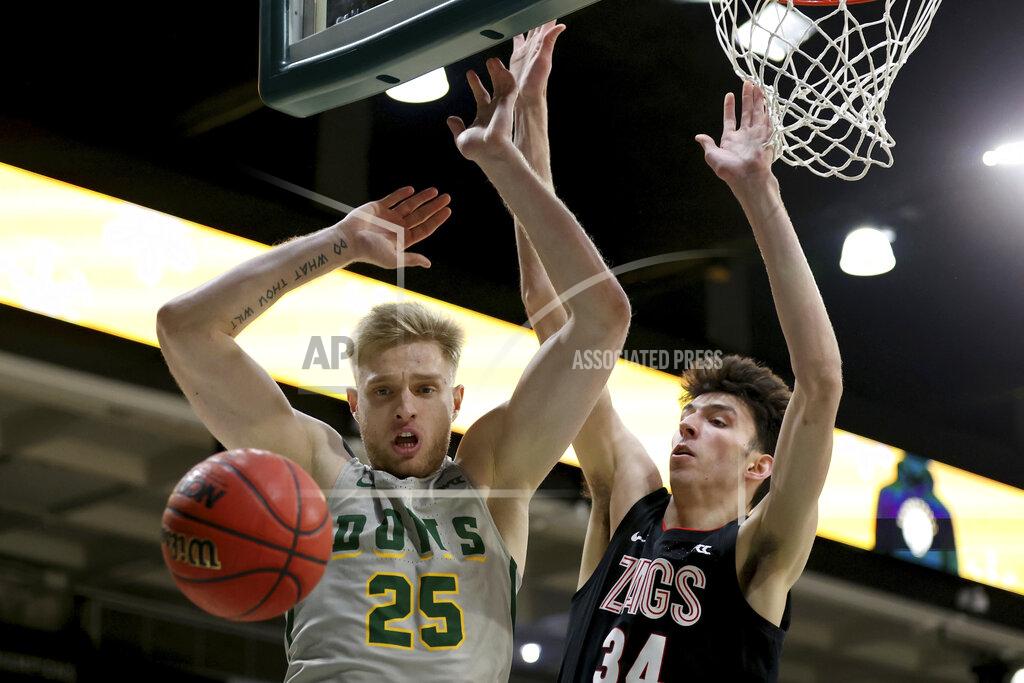 Jed Jacobsohn San Francisco forward Yauhen Massalski (25) is defended by Gonzaga center Chet Holmgren (34) during the first half of an NCAA college basketball game in San Francisco, Calif., Thursday, Feb. 24, 2022. (AP Photo/Jed Jacobsohn)