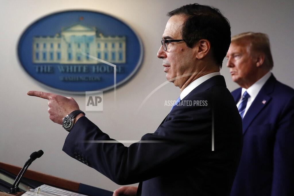 Alex Brandon President Donald Trump listens as Treasury Secretary Steven Mnuchin speaks about the coronavirus in the James Brady Press Briefing Room of the White House, Tuesday, April 21, 2020, in Washington. (AP Photo/Alex Brandon)