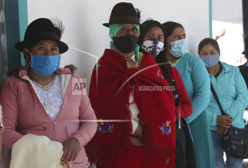 Dolores Ochoa Women line up to cast their ballots in Cangahua, Ecuador, Sunday, Feb. 7, 2021. Ecuadoreans went to the polls in first-round presidential and legislative elections. (AP Photo/Dolores Ochoa)