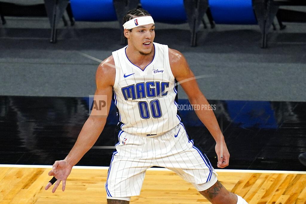 John Raoux Orlando Magic forward Aaron Gordon gestures with his hand holding out 3 fingers after sinking a 3-point shot against the Cleveland Cavaliers during the second half of an NBA basketball game, Monday, Jan. 4, 2021, in Orlando, Fla. (AP Photo/John Raoux)