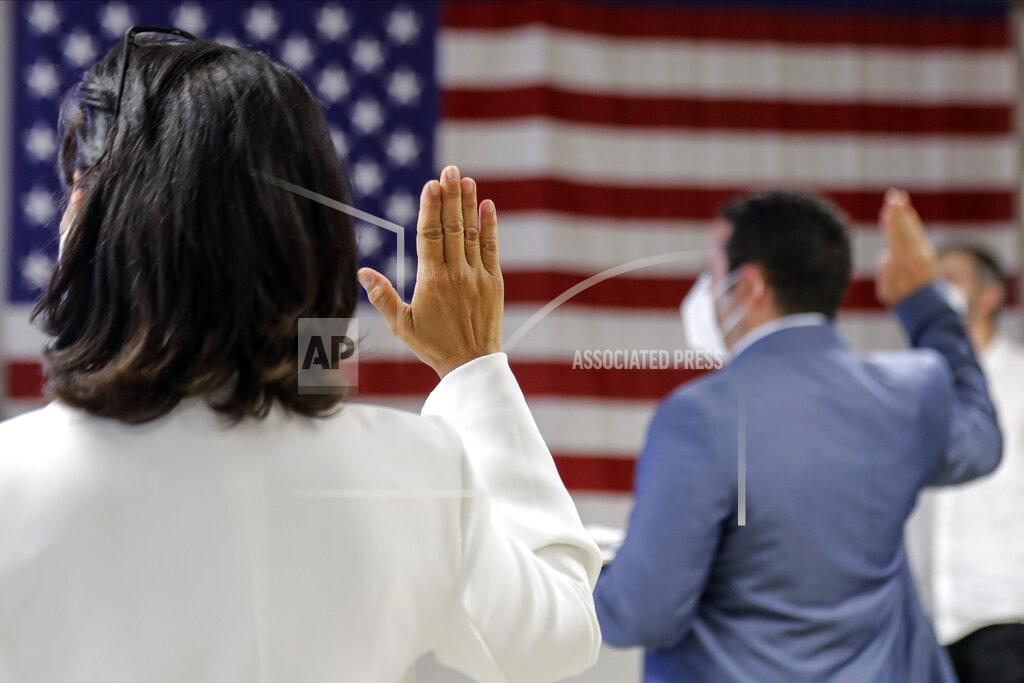 Frank Franklin Ii FILE- In this July 2, 2020, file photo, people take the oath of citizenship during a naturalization ceremony at U.S. Citizenship and Immigration Service's Field Office in New York. Immigrant rights activists energized by a new Democratic administration and majorities on Capitol Hill are gearing up for a fresh political battle. A coalition of national advocacy groups on Monday announced a multimillion-dollar campaign to help push through President Joe Biden’s plan to open a citizenship pathway for up to 11 million people. (AP Photo/Frank Franklin II, File)