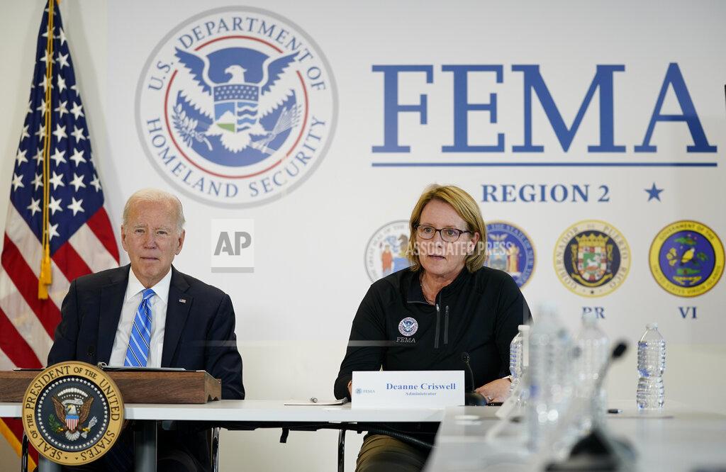 Evan Vucci Federal Emergency Management Agency administrator Deanne Criswell, right, speaks as President Joe Biden visits the FEMA Region 2 office in New York, Thursday, Sept. 22, 2022. (AP Photo/Evan Vucci)